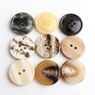 China Sustainable In Custom RTS Resin Round Button Buttons And Black 4 Holes Real White Horn Buttons Eco-Friendly for sale