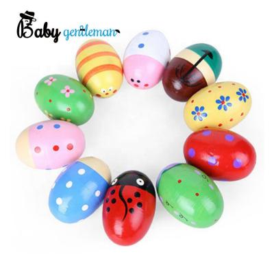 China Best selling solid toy musical instruments wooden wood+rope egg shaker for baby Z07161I for sale