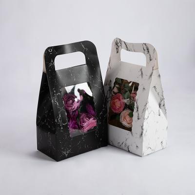 China Recyclable Flower Gift Package Bag With PVC Clear Window Design Paper Handbag White Black Marble Wholesale for sale