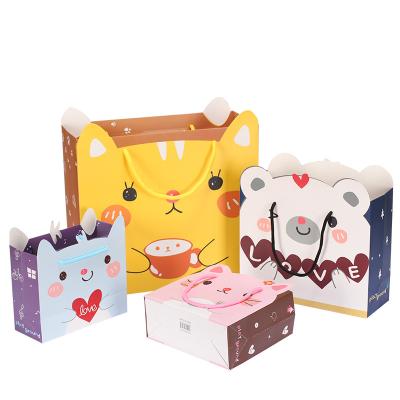 China Recyclable Cute Full Moon Baby Gift Bag Children's Day Cartoon Paper Handbag Birthday Paper Bag Party Supplies for sale