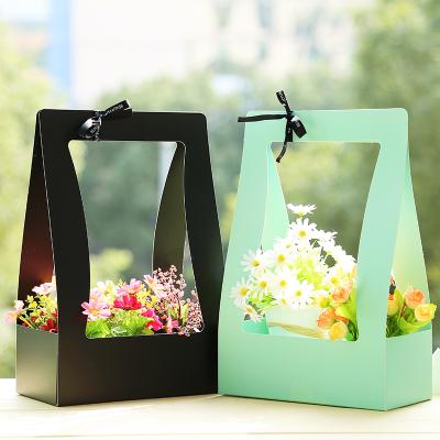 China Portable Flower Box Flower Basket Paper Cardboard Flowers Waterproof Bag Green Flower Carrier Fresh Packing Box Florist Black Pink for sale