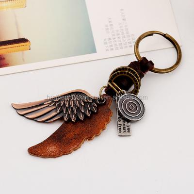 China Environmental Friendly Rush Delivery Vintage Custom Weave Leather Key Chain Metal Wing Pendant Key Ring for sale