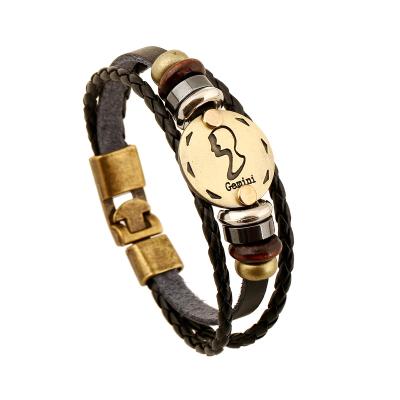 China Punk 12 Zodiac Metal Charm Beaded Hand & Woven Leather Bracelet Braided Cuff Punk Chain Bracelet for sale