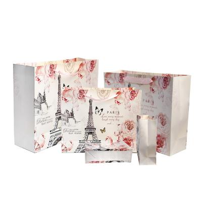 China Recyclable Wholesale Paper Shopping Bags Printed Cheap Elegant Printing Paper Bag With Your Own Logo for sale