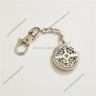 China Fashionable Zinc Alloy Round Essential Oil Diffuser Pendant Key Chain for sale