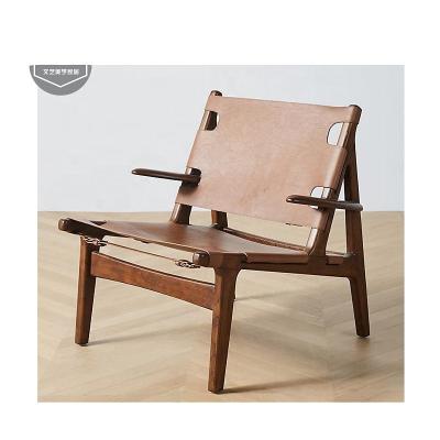 China Modern Leather Wooden Simple Saddle Chair Living Room Designer Armrest Backrest Leisure Solid Wood Chair for sale