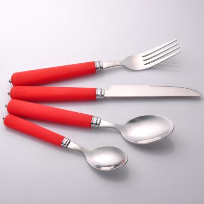 China Viable hot sale wholesale price stainless steel dinnerware set with red plastic handle suitable for hotels for sale