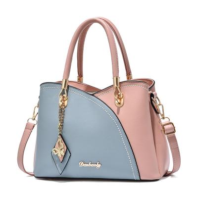 China Durable Creative Color Blocked Handbags Women Durable PU Leather Crossbody Hand Bag For Birthday Gifts for sale