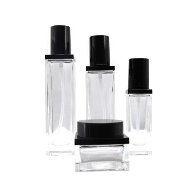 China 15ml 30ml 40ml 100ml Luxury Empty Square Silk Screen Face Lotion Cream Glass Bottle Jar Black Cosmetic Package Printing TOMONI Set With Spray Pump for sale