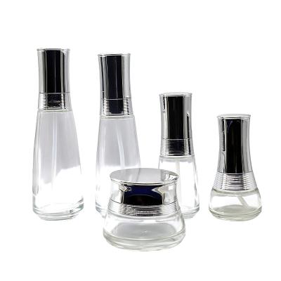 China 2022 New Design 1oz 30ml Silk Screen Printing Transparent Sprayer Bottle Wholesale Clear Serum Glass Bottle For Skin Care Cosmetic Packaging for sale