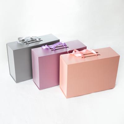 China Custom High End Folding Board Ribbon Closure Recycled Magnetic Clothing Materials Gift Box for sale