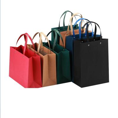 China Biodegradable Colorful Heavy Kraft Rivet Shopping Gift Bag With Thick Handles Custom Logo Printing Paper Handbags for sale