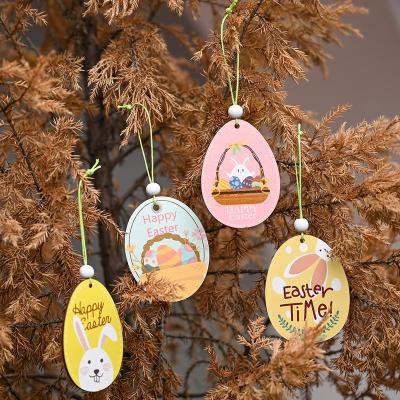 China Colorful Painted Wooden Easter Egg House Hanging Ornament Cartoon Rabbit Happy Easter Time Party Home Decoration for sale