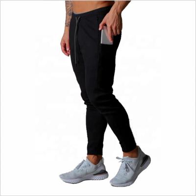 China Anti-Static Mens Fashion Loose Casual Logo Sweatpants Men Pants Joggers Custom Fitted Pants Gyms With Phone Pocket for sale