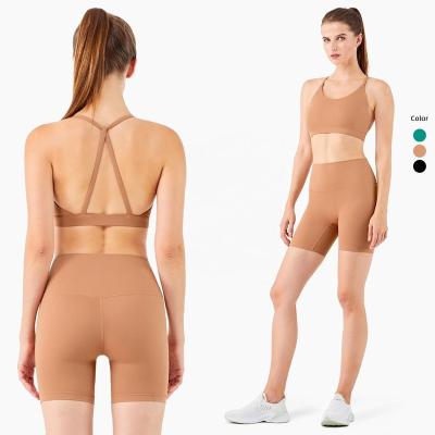 China Breathable OEM Sexy 2 Piece Women Sport Wear Slim Straps Set Cross Back Workout Bra And Crop Set for sale