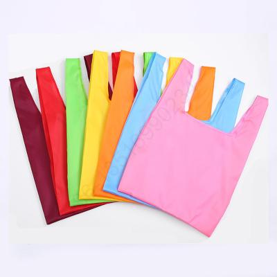 China Popular T-shirt Design Bag Shape Vest Handled Foldable Shopping Bag for sale