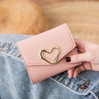 China 2022 waterproof practical three off the pocket soft leather women's card bags heart-shaped women's short wallet wholesale for sale