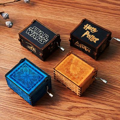 China Dropshipping Amazon Best New Arrival Hand Cranked Custom Carved Black Wood Crank Music Box for sale