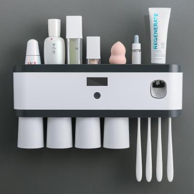 China Viable High Quality Magnetic Plastic Wall Mounted Auto Accessories Cute UV Toothpaste Dispenser Toothbrush Holder for sale