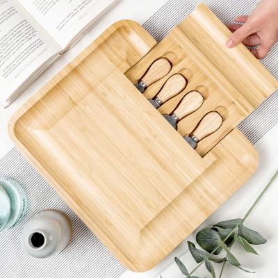 China Kitchen Premium Bamboo Cutting Board Stocked Wooden Chopper for sale