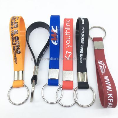 China Wholesale Custom Printed Personalized Sports Silicone Wristband Bracelet Key Chain For Business Gift for sale