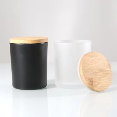 China Home Wholesale Custom Round Glass Candle Jar With Lids Matte Black And White Large Candle Jar Kinds for sale