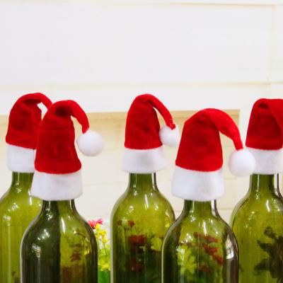 China Home Nonwoven Christmas Wine Bottle Cover Mini Santa Hat Christmas Tabel Decoration Dinner Table Decor for sale