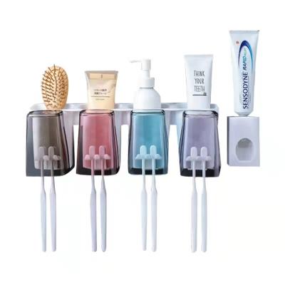 China Viable Wholesale Wall Mounted Exquisite Home Decoration Automatic Toothpaste Squeezing Plastic Bathroom Toothpaste Dispenser for sale