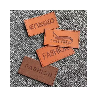 China Hot Sale Folding Handmade Labels Leather Embossed Leather Clothing Labels Leather Handmade Labels for sale