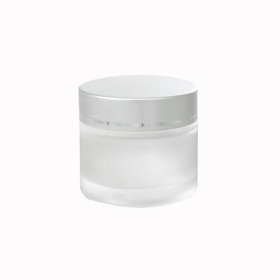 China Sustainable 30g 50g Luxury Round Shape Frosted Cream Glass Cosmetic Packaging Jars With Silver Screw Lid for sale