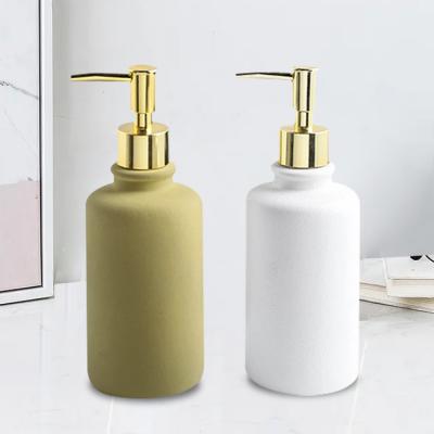 China 250ml Cosmetic High Quality Luxury Custom Size Hotel Travel Innovative Ceramic Shampoo Bottle White And Gold Color for sale