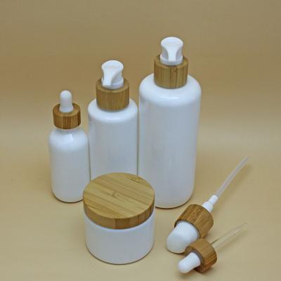 China Oi Essential Luxury White Porcelain Essential Oil Dropper Glass Bottle 10ml 15ml 30ml 50ml 100ml With Bamboo Cap Glass Empty Bottle for sale