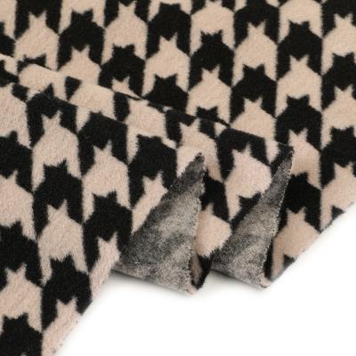 China Autumn winter textile houndstooth design jacquard anti-static warp knit wear polyester fabric for lady outerwear for sale