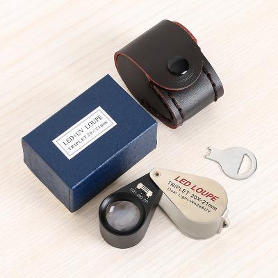 China Silver Examination Factory Handheld Folding 20X Optical Glass Lens With Rng High Brightness LED Jewelry Magnifier for sale