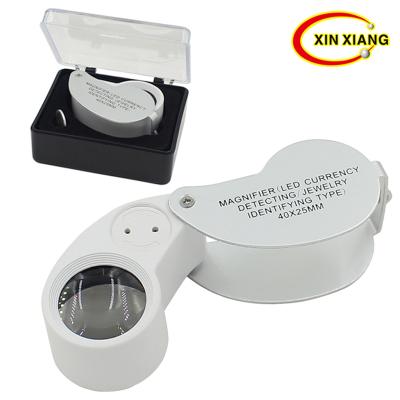 China Hot Selling Silver 40X25MM Examination Jewelry Times Hand Held Magnifier With 2LED 1UV Lamp Portable Antique Identification Tool for sale