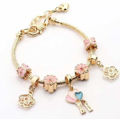 China Best Selling Rhinestone Crystal Flower Heart Charm DIY Bangle Jewelry Oil Drop Flower Charm Bracelet Gold Bangle for sale