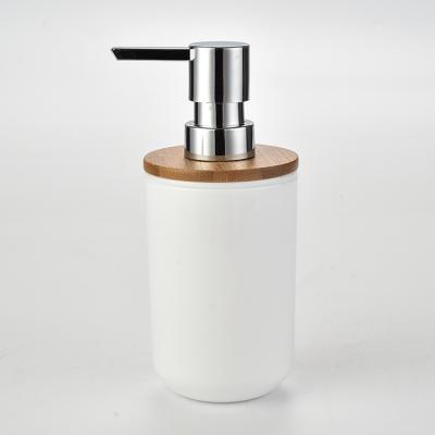 China Traditional Plastic White PS Soap Dispenser Bottle With Natural Bamboo Lid And High Quality Chromed Lotion Pump for sale