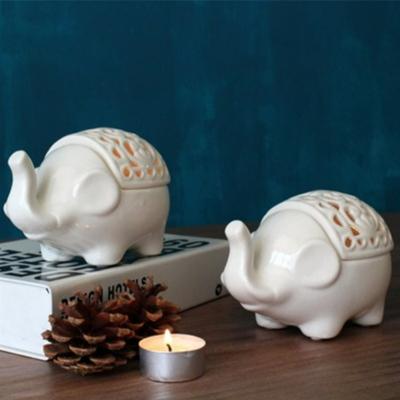 China White Ceramic Craftsman Elephant Candle Holder Hollow Aromatherapy Stove for sale