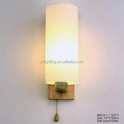 China Modern New Design Hotel Bedroom Glass Sconce Wall Lamp For Home Energy Saving Wood Base Led Wall Light for sale