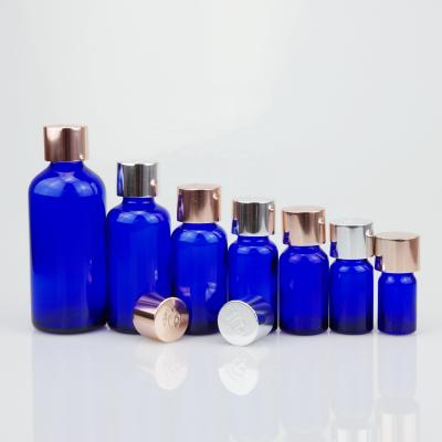 China Essential oil blue color essential oil glass bottle with 18/415 aluminum cap for sale