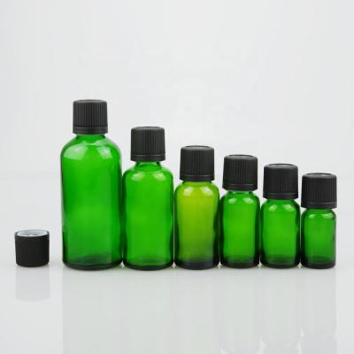 China High Quality Green Essential Oil 15ml Glass Bottle With 18/415 Tamper Resistant Child Resistant Cap for sale