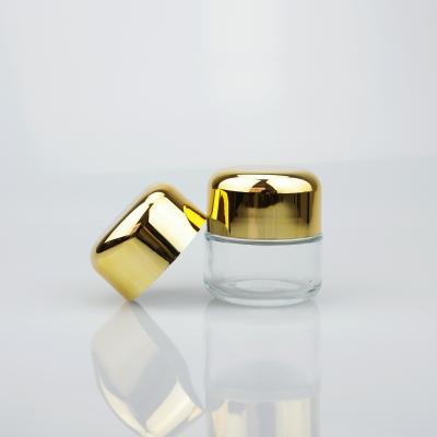 China 50ml Matte Clear Cosmetic Glass Eye Cream Jars With Silver And Gold Aluminum Lid for sale