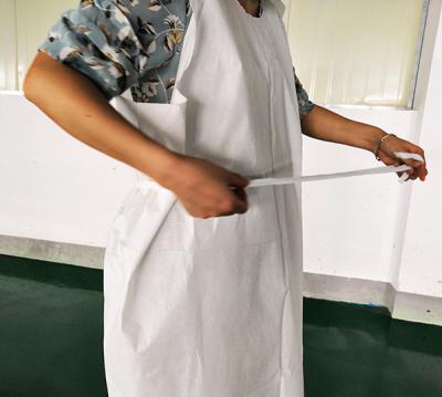 China Tissue+poly Disposable Paper Examination Gown for sale