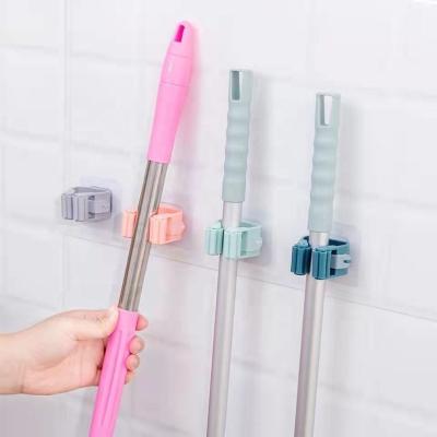 China Hot Selling Adhesive Organizer CLASSIC Wall Mounted Plastic Bathroom Broom Hook Holder Storage Broom Clip Holder for sale