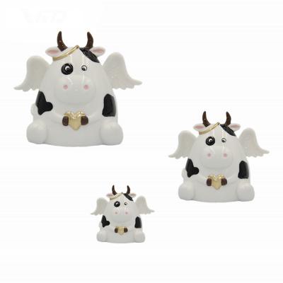 China 2022 Angel Cow Money Saving Ceramic Animated Box Toy Ceramic Porcelain Money Safe Bank for sale