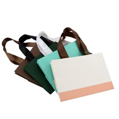 China OEM+ODM+Wholesale Luxury Jewelry Gift Packaging Bags With Rope Handle Jewelry Bags Custom Shopping Bags for sale