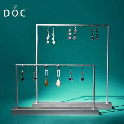 China Fashion Hot White Resin Jewelry Display Stand OEM+ODM+Wholesale Metal Gold Jewelry Props Jewelry Store Window Display for sale