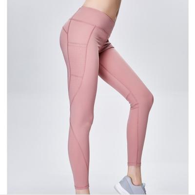 China 2021 Breathable Sexy Buttocks Yoga Pants Tight Pocket Fitness And Yoga Wear For Woman With High Waist Sports Pants for sale