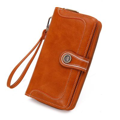 China New Vintage Large Capacity Hot Wax Leather Handheld Multifunction Long Women's Phone Bag for sale