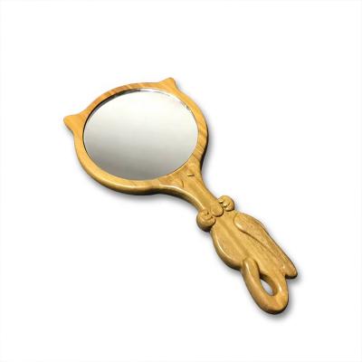 China Cute Wooden and Fashion Animal Hand Carved Crafts Mini Makeup Wooden Hand Mirror for sale